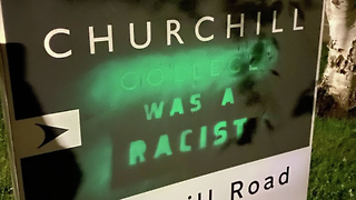 XR activists paint “Churchill was a racist” onto College sign