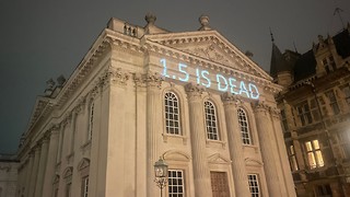 Activists project environmental message on Senate House 